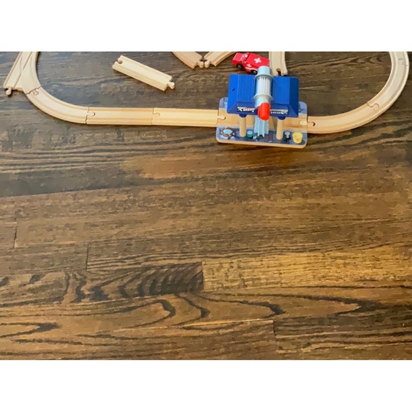 Other - Wooden train tracks at was car wash, and ambulance